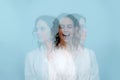 Singing woman, facing three different directions. Triple exposure portrait