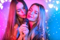 Singing Women with Microphone, party, Karaoke bar. Beauty Glamour girl friends singing and dancing on Stage. Rock singers Royalty Free Stock Photo