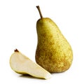 Single abate fetel pear next to a slice of pear isolated on whit
