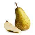 Single abate fetel pear next to a slice of pear isolated on whit Royalty Free Stock Photo