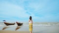 Single Asian girl looking at sea horizon at Muine village