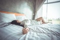 Single asian woman sleeping alone in bed at home. Lonely lady missing husband or boyfriend. Hand on pillow. Solitude, infidelity Royalty Free Stock Photo