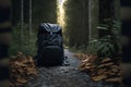 Single backpack in the middle of nowhere on a lonely road or path in the woods