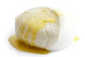 Single ball of mozzarella cheese covered with oil, isolated.