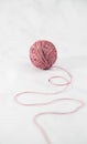 Single ball of unwound pink yarn