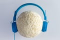 Single ball of waxed string with blue headphones