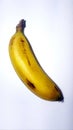 Single banana with white background