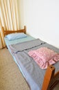 Single bed in motel Royalty Free Stock Photo