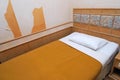 Single bed in old hotel room Royalty Free Stock Photo