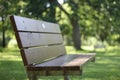 Single bench in a green park Royalty Free Stock Photo