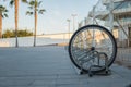 a single bicycle wheel on the street due to stealing Royalty Free Stock Photo