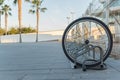 a single bicycle wheel on the street due to stealing Royalty Free Stock Photo