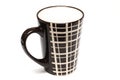 A single big tall dark brown coffee cups with simple lines design