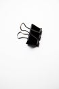 Single binder clip over white background