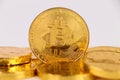 Single Bitcoin coin standing on top of other gold coins. Royalty Free Stock Photo