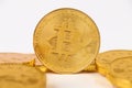 Single Bitcoin coin standing on top of other gold coins. Royalty Free Stock Photo