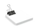 Single black binder clip on white paper Royalty Free Stock Photo