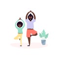 Single black father and son african americans doing yoga exercises together in room at home