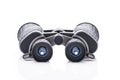 Single black pair of binoculars isolated on a white background Royalty Free Stock Photo