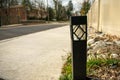 A Single Black Path Light in a Patch of Grass on a Street in Suburban Pennsylvania