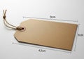 Blank kraft paper gift tag with string and dimensions Royalty Free Stock Photo
