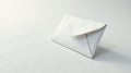A single blank white envelope rests on a pristine white surface, ready for a message of hope, love, or important correspondence. Royalty Free Stock Photo