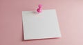 Pink Pushpin Securing a Blank White Square Paper Note on a Soft Pink Background image photo Royalty Free Stock Photo
