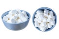 Single blue circle ceramic bowl full of many pieces of raw sweet tasty marshmallows cylindrical form isolated on white background