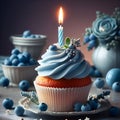 Single blue Cupcake With a Burning Candle on blue Background Royalty Free Stock Photo