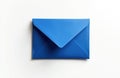 Single blue envelope rests on plain white surface. This mail object is closed and clean, suggesting communication or blank Royalty Free Stock Photo