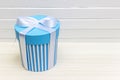 Single blue gift box on white wood table Royalty Free Stock Photo
