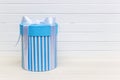 Single blue gift box on white wood table Royalty Free Stock Photo