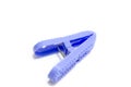 Single blue plastic clothespin cloth peg on white background