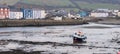 A single boat, in Aberaeron harbour, on the west coast of Wales