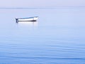 Single boat on the Atlantic Ocean in Walvis Bay, at sunrise