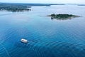 Single boat by the island and Croatian shore