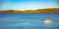 A single boat resting near Houhora habour. Houhora is a locality and harbour on the east side of the Aupouri Peninsula of Royalty Free Stock Photo