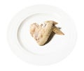 single boiled chicken wing on white plate isolated