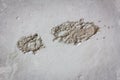 Single boot footprint on wet concrete in construction site Royalty Free Stock Photo