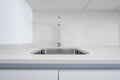 Single bowl sink in light gray silestone countertop Royalty Free Stock Photo