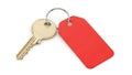 Single brass house key attached to a bright red blank rectangular tag on a white background Royalty Free Stock Photo