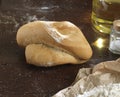 Single bread on a rustic wooden countertop natural food and ingredients , Royalty Free Stock Photo