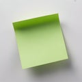 Single bright green sticky note paper on a light grey background with shadow light green Royalty Free Stock Photo