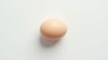 Single brown egg on a plain white background Royalty Free Stock Photo