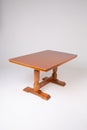 Single brown table with empty surface and carved legs on an isolated