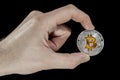 Single BTC Bitcoin coin in hand Royalty Free Stock Photo