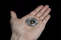 Single BTC Bitcoin coin on hand Royalty Free Stock Photo