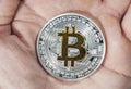 Single BTC Bitcoin coin on hand Royalty Free Stock Photo