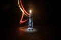 Single burning candle. Light of flame and flowing candle wax, dark background Royalty Free Stock Photo