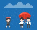 Single Businesswoman walking under the rain, while businessman h Royalty Free Stock Photo